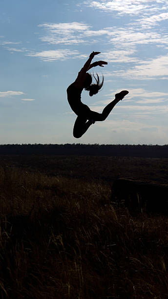 istock Graceful acrobatic woman leaping 158172222