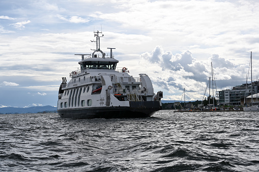 Oslo, Norway, July 4, 2023 - The ferry Dronningen a double-ended ferry of the Norwegian Shipping Company Norled  (with a gas-electric Propulsion) in the Oslo Fjord.