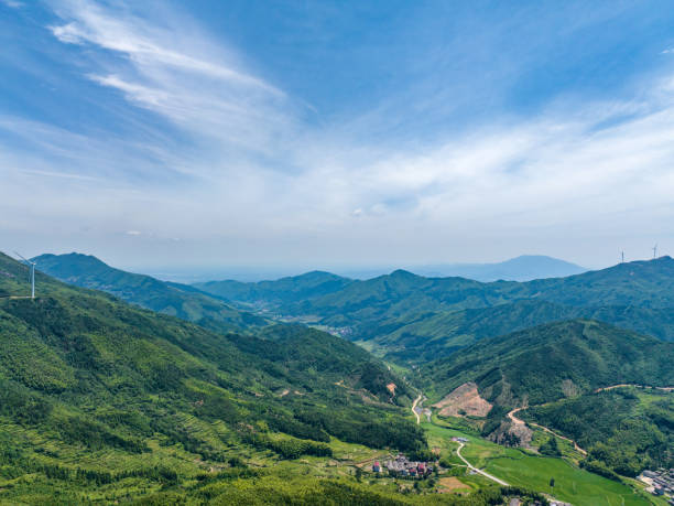 istock Wind farm on the mountain, blue sky and white clouds 1581736648
