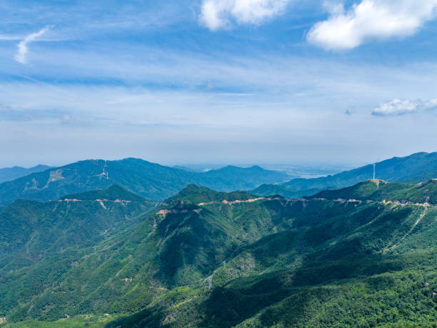 istock Wind farm on the mountain, blue sky and white clouds 1581749195