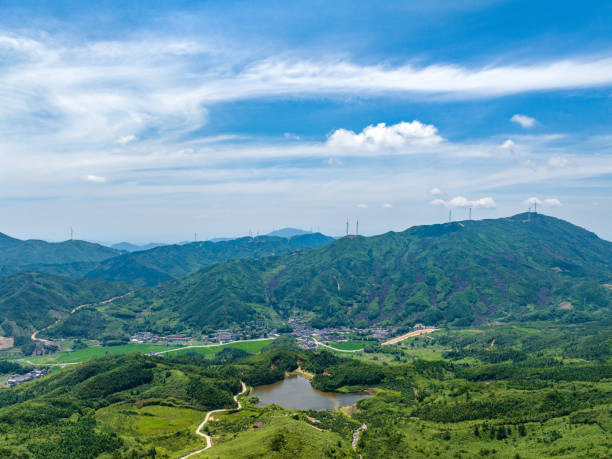 istock Wind farm on the mountain, blue sky and white clouds 1581756418