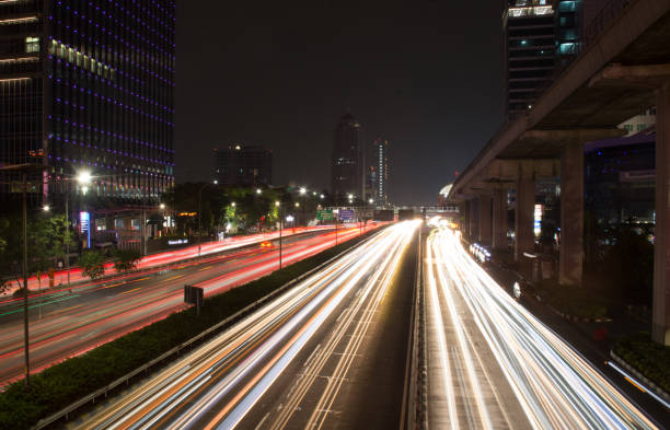 istock Jakarta Night Traffic Light Trails – Slow Shutter Technique 1581795484