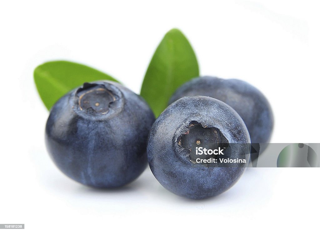 Blueberries with leaves Blueberries with leaves on white background Antioxidant Stock Photo