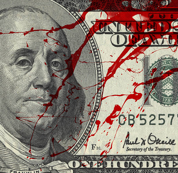 Blood Money Fragment of 100 dollar bill with blood spots bloody money stock pictures, royalty-free photos & images