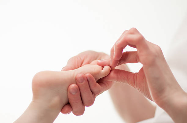 istock The therapeutic massage for a baby's feet 158185649