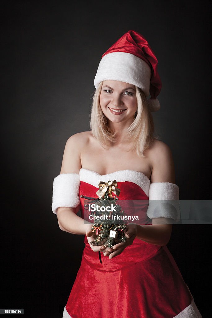 Santa menina com árvore de Natal. - Foto de stock de Adulto royalty-free