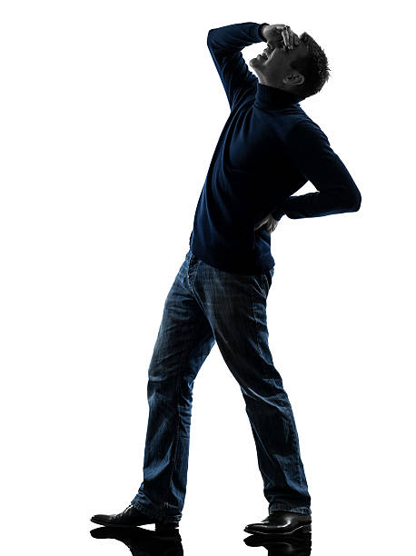 istock man backache pain silhouette full length 158186123