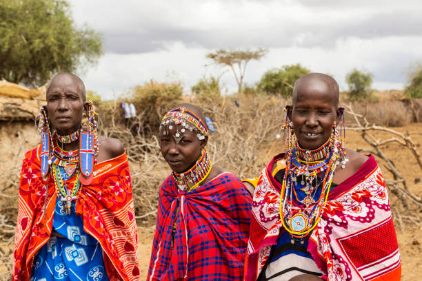 istock Three Maasai women outside their village. 158188561