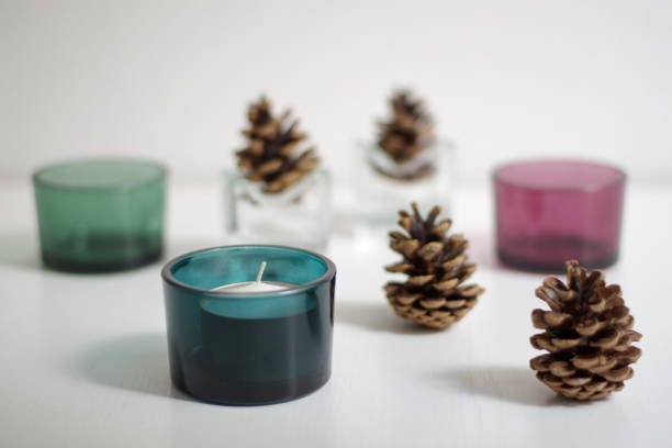 istock Christmas decoration with candles and pine cone 1581899797