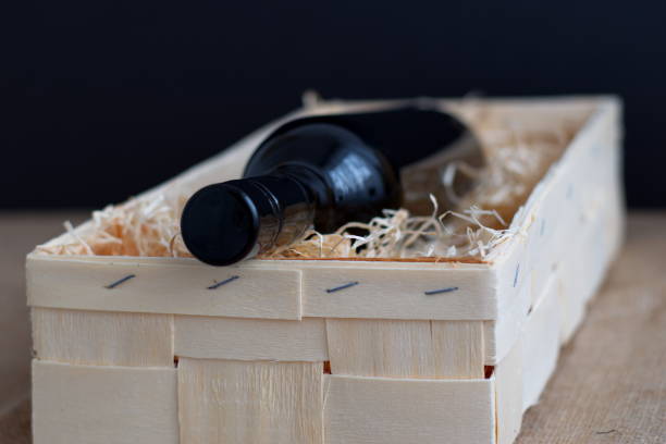 istock Bottle of wine in wooden box 1581900357