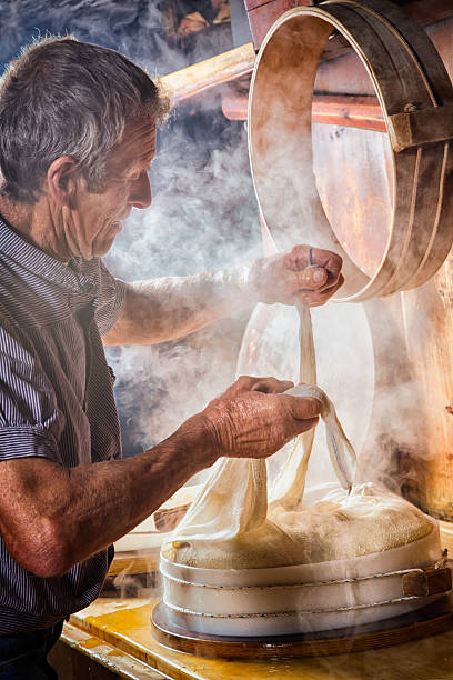 Senior Swiss Farmer making cheese