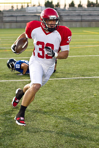 running back in motion - american football imagens e fotografias de stock