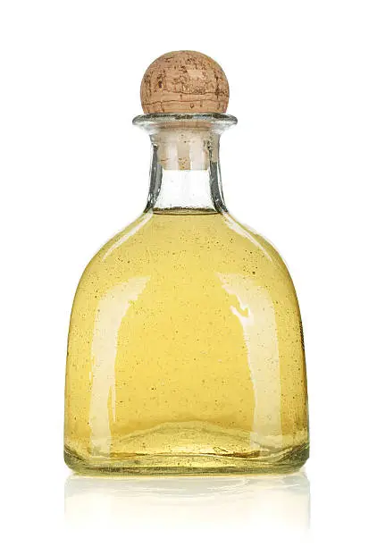 Bottle of gold tequila. Isolated on white background