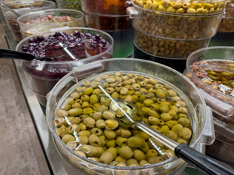 Different kind of olives in a retail display