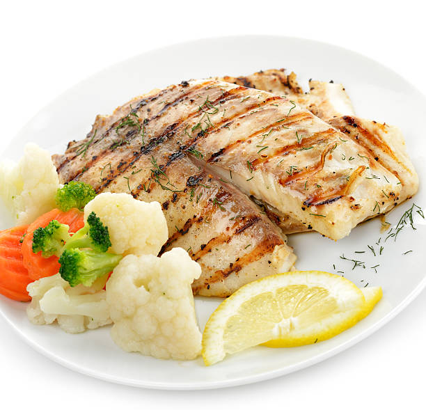 istock A grilled fresh fish fillet with vegetables and lemon 158197138
