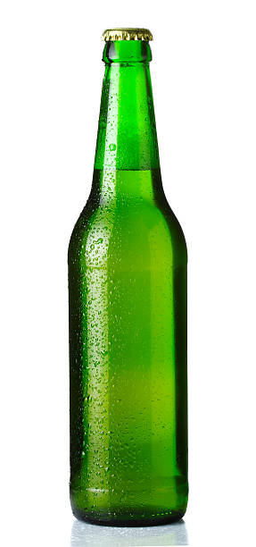 istock Green bottle of beer with drops on white 158197190