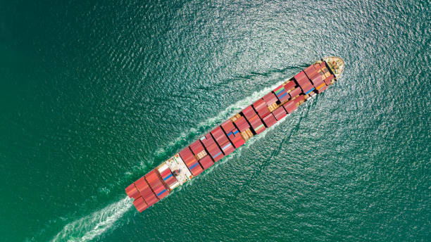 istock cargo container ship sailing full speed in sea to import export goods and distributing products to dealer and consumers worldwide, by container ship Transport business delivery service, aerial view 1581978625