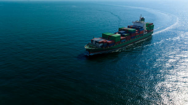 istock container cargo ship import export global business and industry commercial trade logistic and transportation of international by container cargo ship in the open sea, Container cargo freight shipping, front view drone shot, 1581979642