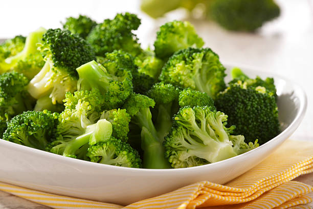 Broccoli Steamed broccoli in a bowl close up steamed photos stock pictures, royalty-free photos & images