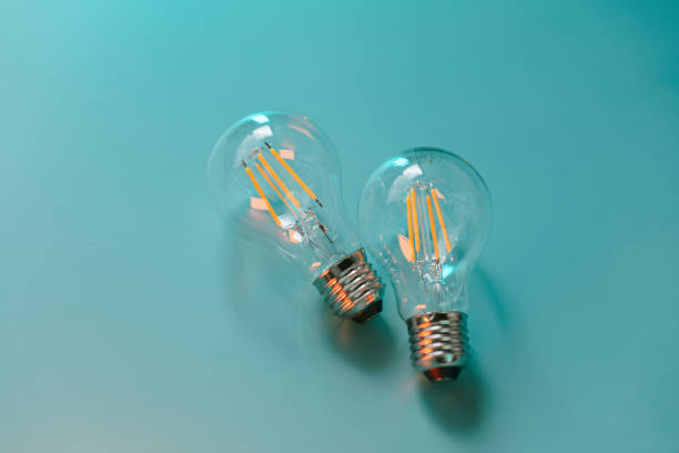 istock Electricity and energy saving concept.Energy saving light bulbs on a blue background 1582008517