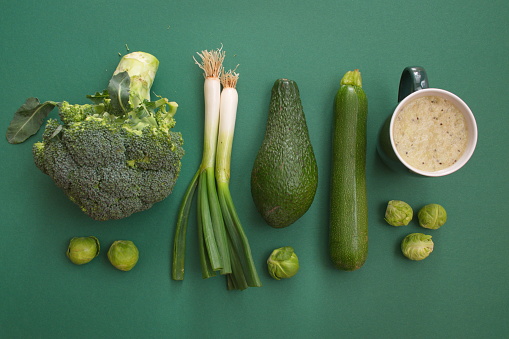 Top shot of green vegetables on green background