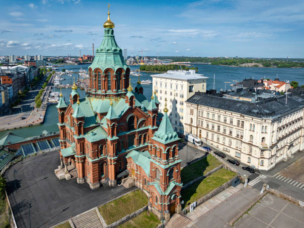 Uspenski Cathedral in the capital city of Helsinki on hill top close to harbour towards the Baltic Sea in summer. Aerial Drone Point of view of the greek orthodox baubly domed landmark cathedral. Situated in Helsinki Finland, it is the largest Greek Orthodox church in Western Europe. Helsinki, Finland, Nordic Countries, Northern Europe