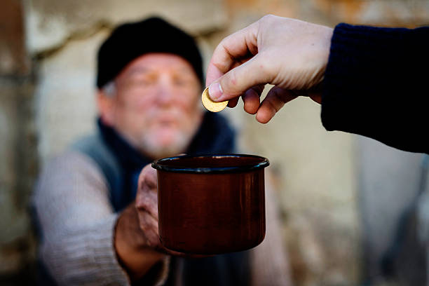 Homeless Homless man is begging on the street Begging stock pictures, royalty-free photos & images