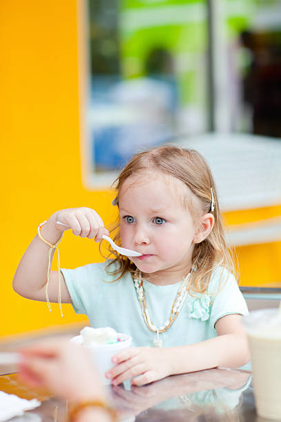 istock Adorable girl eating ice cream 158207357