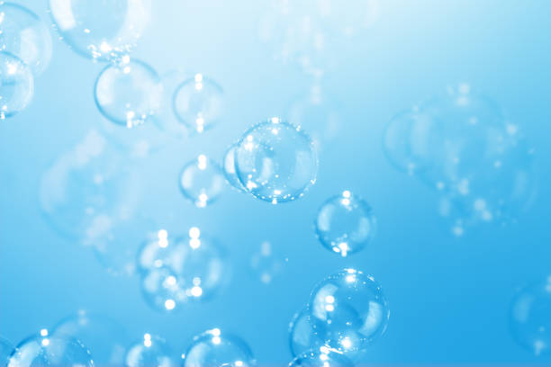 istock Beautiful Transparent Shiny Blue Soap Bubbles Floating in The Air. Abstract Background, Blue Textured, Celebration Festive Backdrop, Refreshing of Soap Suds, Bubbles Water. 1582081710