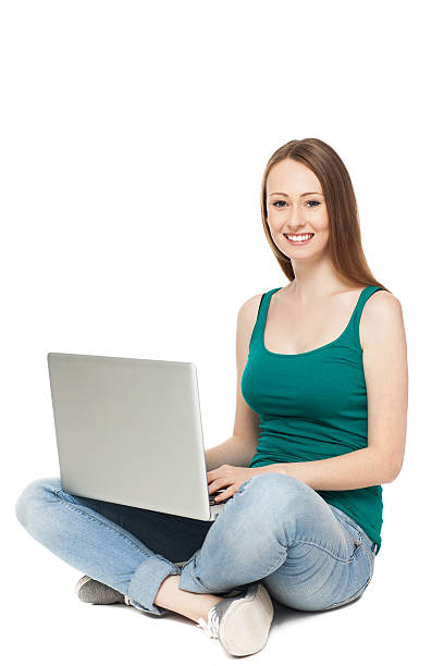 istock Young woman sitting with laptop 158208475