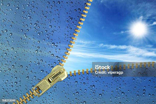 Unzipped Glass With Water Drops Revealing Blue Sky Stock Photo - Download Image Now - Zipper, Rain, Sun