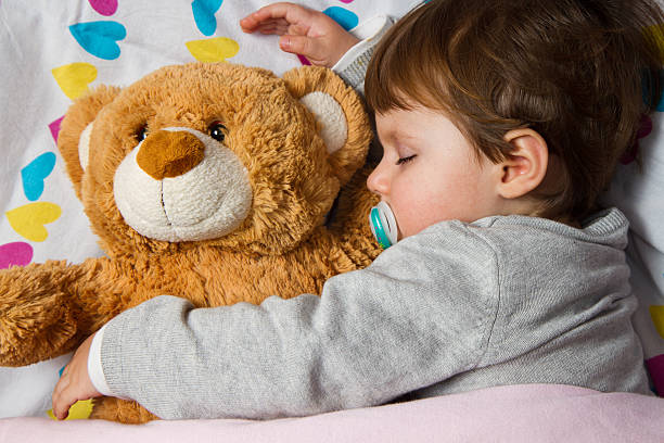 istock Sweet child sleeping with teddy bear 158213616