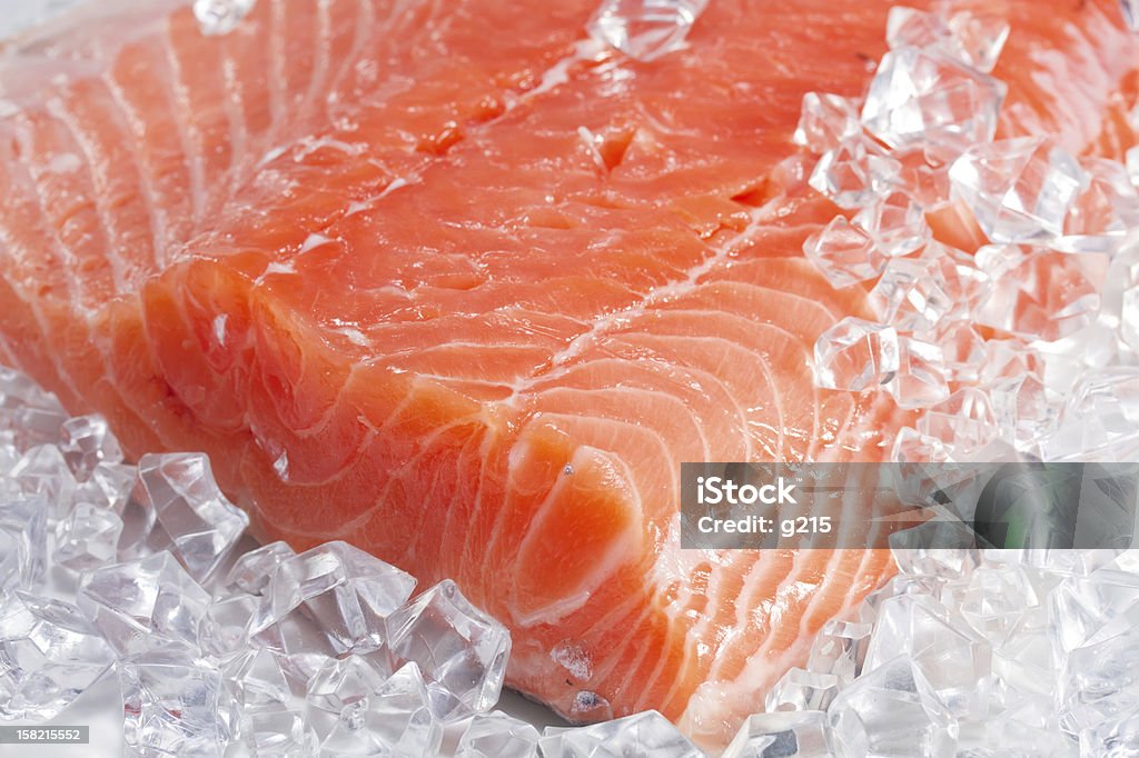 Close up image of a salmon fillet on cubed ice salmon on ice Salmon - Seafood Stock Photo