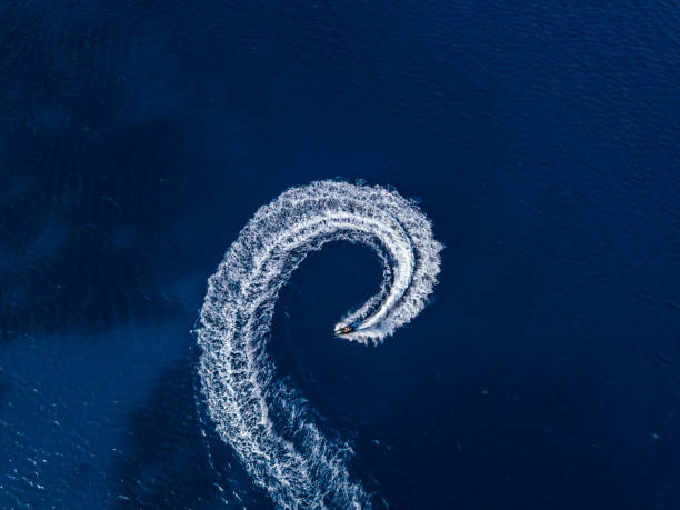 istock Aerial view on jetski in tropical blue waters 1582180010