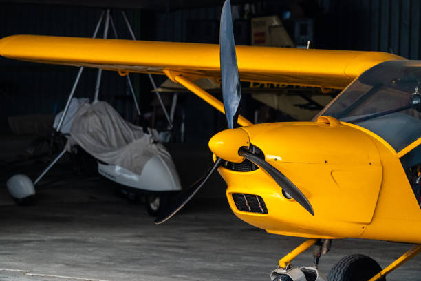 istock yellow  biplane inside the hangar. 1582183767