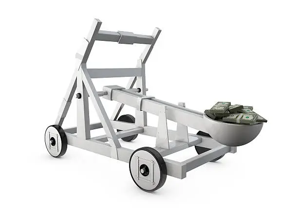 Catapult prepared to throw money isolated over white.