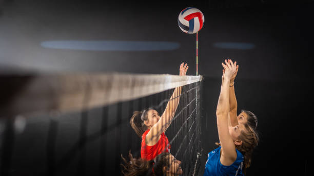 istock Women hands hitting volleyball ball 1582215536
