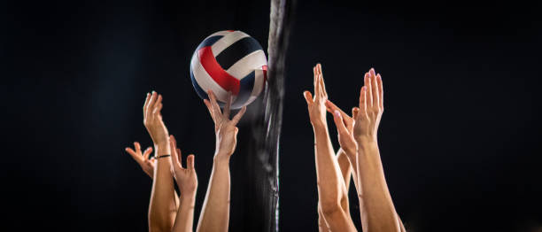 istock Women hands throwing volleyball ball 1582215557