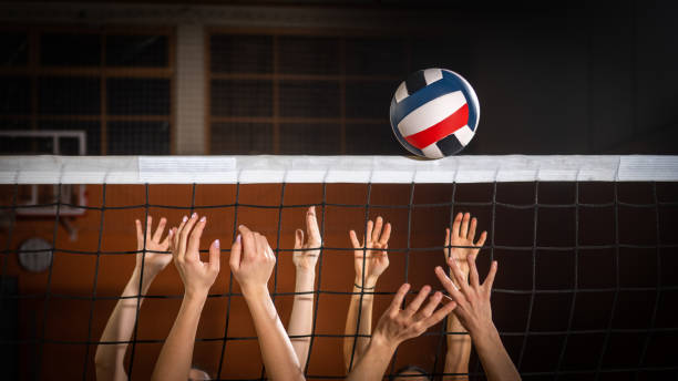 istock Women hands blocking volleyball ball 1582215562