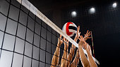Women hands blocking volleyball ball