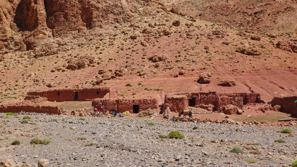 istock simple architecture of small mud huts in Morocco. 1582231387