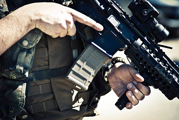 Army Soldier Carrying an M4 Assault Rifle stock photo
