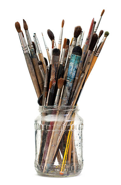 istock Assorted dirty painting brushes in glass flask 158223298