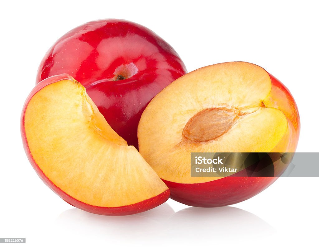 red plums ripe red plums isolated on white background Cross Section Stock Photo