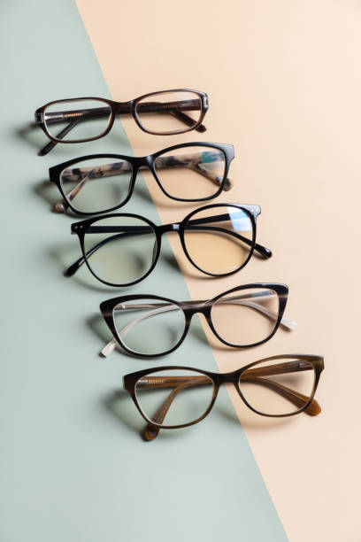 istock Stylish eyeglasses on colored background. Optical store, vision test, stylish glasses concept. 1582275303
