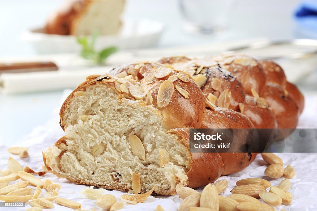 Sweet braided bread Sweet braided bread with almonds and raisins Almond Stock Photo