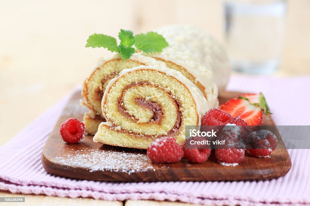 Swiss roll Swiss roll glazed with white chocolate icing Swiss Roll Stock Photo