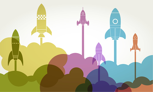 Colourful silhouettes of rockets to symbolise new business startup launch. usiness Startup concept, Launch, rocket, start up, entrepreneur, spaceship, exploration,