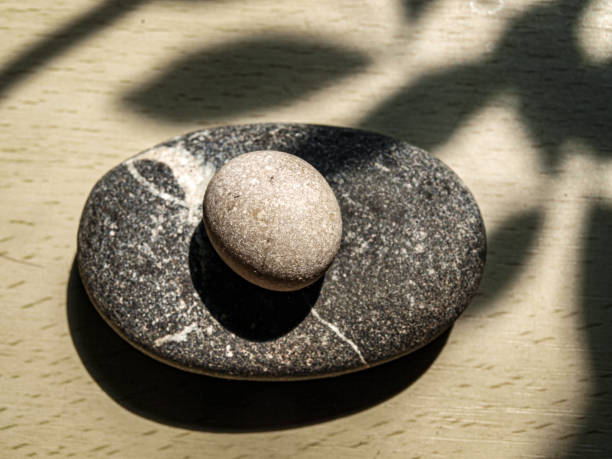 zwei steine wie zen-ruhe - stone zen like buddhism pebble stock-fotos und bilder