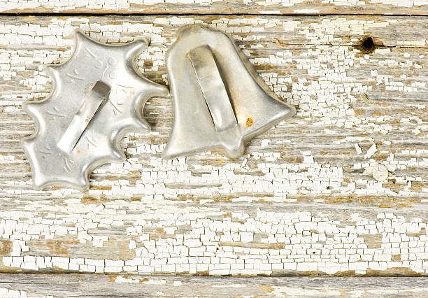 istock Two old Christmas cookie cutters on a weathered board 158232563